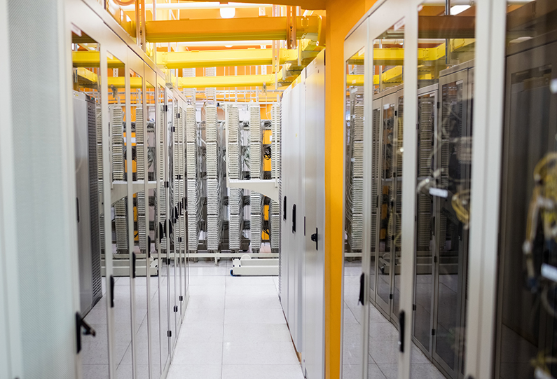 hallway with a row of servers